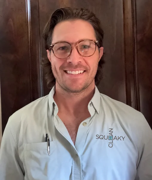 Kyle Taylor, owner of Squeaky Clean Window Washing, wearing a Squeaky Clean work shirt